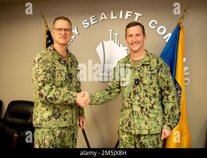 Norfolk, Va. (March 21, 2022) - Rear Adm. Mark Melson, Deputy Director, Joint Force Development and Design Integration, Joint Staff, poses for a photo with Rear Adm. Michael Wettlaufer, Commander, Military Sealift Command (MSC), during his tour of MSC. Melson received a command brief during his visit where he learned about the overview and history of MSC. Stock Photo