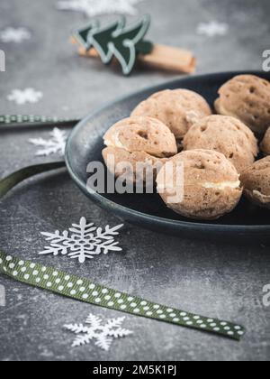 Nuts stuffed with vanilla cream. Traditional homemade slovak christmas cookies. Close up. Stock Photo