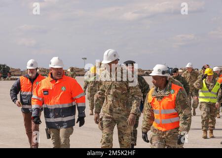 U.S. Army Maj. Gen. James Smith (center), commander of 21st Theater Sustainment Command, meets with senior leaders from 839th Transportation Battalion, 598th Transportation Brigade (Military Surface Deployment & Distribution Command), and others to assess the port operation and reception, staging and onward movement (RSOM) of equipment at a port in Alexandroupoli, Greece, March 21, 2022. The RSOM operations are in support of 3rd Armored Brigade Combat Team, 4th Infantry Division’s arrival into Europe for Atlantic Resolve. Under the command of the U.S. Army V Corps and 1st Infantry Division, 3r Stock Photo
