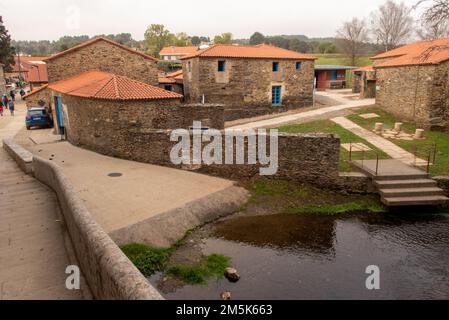 The old stone buildings of the historic pilgrim's albergue on in Ribadiso da Baixo originate from the 15th century and were an important stop on the Way of St. James . They were rebuilt and renovated in the 1990s and today serve again as a hostel. Stock Photo