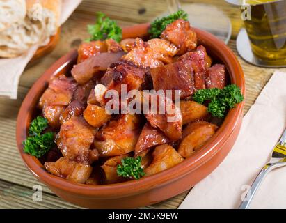 Spanish dish - roasted pig nose and cheeks Stock Photo - Alamy