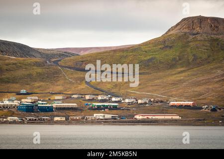 Hamlet of Arctic Bay on the shore of Baffin Island off Admiralty Inlet ...