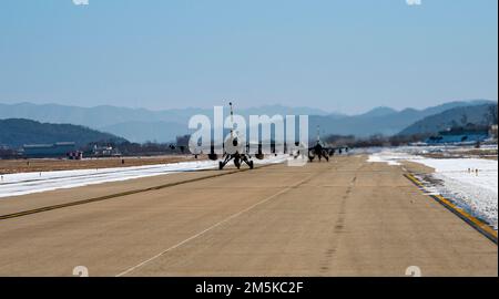 Three F-16 Fighting Falcon’s assigned to the 36th Fighter Squadron taxi on the runway before flight during a training mission at Osan Air Base, Republic of Korea, Dec. 28, 2022. The F-16, first introduced to the USAF in 1979, is a highly maneuverable multi-role fighter aircraft and has proven itself in air-to-air combat and air-to-surface defense. (U.S. Air Force photo by Staff Sgt. Dwane R. Young) Stock Photo