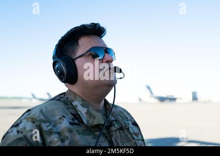 U.S. Air Force Staff Sgt. Jaime Sanchez, 22nd Airlift Squadron flight engineer, performs preflight procedures at Travis Air Force Base, California, March 22, 2022. Flight engineers are responsible for monitoring all aircraft engine and control systems while in-flight. They also perform pre-flight and post-flight inspections. Stock Photo
