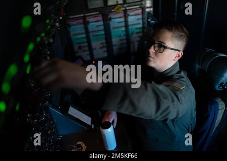 U.S. Air Force Staff Sgt. Clark Alexis, 22nd Airlift Squadron flight engineer, performs preflight procedures at Travis Air Force Base, California, March 22, 2022. Flight engineers are responsible for monitoring all aircraft engine and control systems while in-flight. They also perform pre-flight and post-flight inspections. Stock Photo