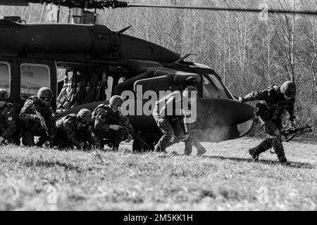 Army aviation crew members train with UH-60 Black Hawk helicopters in ...