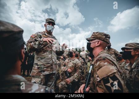 U.S. Army Gen. Charles Flynn, commander, U.S. Army Pacific, speaks with the Soldiers of 4th Battalion, 23rd Infantry Regiment, 2nd Brigade Combat Team, 2nd Infantry Division, during the closing ceremony of Hanuman Guardian 2022 in Lopburi, Kingdom of Thailand, March 24, 2022. HG 22 provides a venue for both the United States and the RTA to advance interoperability and increase partner capacity in planning and executing complex and realistic multinational force and combined task force operations. Stock Photo