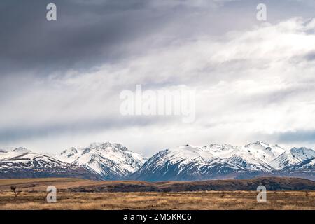 Scenic view of Lake Tekapo east bank. Beautiful view driving along the Lilybank Road from Lake Tekapo Park towards Motuariki View Point. Stock Photo