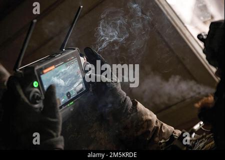Leonid, a Ukrainian drone operator watches as artillery strikes Russian positions. Leonid joined the Ukrainian armed forces shortly after the invasion in Februrary, and now works to correct artillery fire. Stock Photo