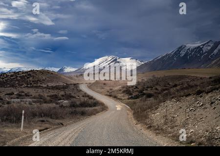 Scenic view of Lake Tekapo east bank. Beautiful view driving along the Lilybank Road from Lake Tekapo Park towards Motuariki View Point. Stock Photo