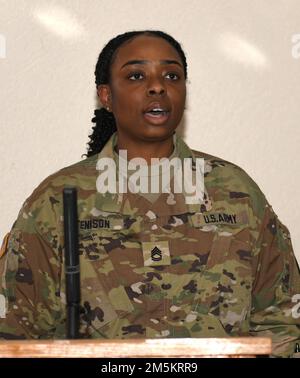 U.S. Army Sgt. 1st Class Chasidy Tenison, Public Health Command Europe  Environmental Health Sciences Division Noncommissioned Officer in Charge, sings  the German and American National Anthem at the Public Health Command Europe  Relinquishment of Responsibility Ceremony at Landstuhl, Germany. Stock Photo