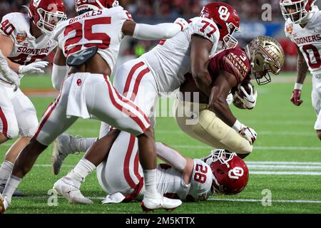 December 29, 2022: Florida State Seminoles running back TREY BENSON (3) gets tackled after running the ball during the 2022 NCAA Cheez-It Bowl game between the Florida State Seminoles and Oklahoma Sooners at Camping World Stadium in Orlando, FL on December 29, 2022. (Credit Image: © Cory Knowlton/ZUMA Press Wire) Stock Photo