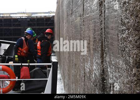 Crewmembers aboard Coast Guard Cutter Spar monitor the starboard bow of the vessel while entering a lock in the Welland Canal, March 23, 2022. The Spar and her crew are traveling to Duluth, Minn. after a year-long maintenance period in Baltimore. Stock Photo