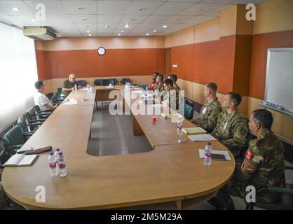 U.S. Army and Oregon Army National Guard delegates along with Bangladeshi members participate in a battalion level exercise scenario meeting held at the Bangladesh Institute of Peace Support Operation Training (BIPSOT) center in Dhaka, Bangladesh March 24, 2022. Delegates from the Oregon National Guard are attending Exercise Tiger Lightning 2022, which is a bilateral exercise sponsored by the U.S. Indo-Pacific Command and hosted by the Bangladesh Armed Forces, strengthening Bangladesh defense readiness, building operational interoperability, and reinforcing partnership between the Bangladesh A Stock Photo