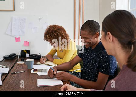 Entrepreneurs doing what they do best. a group of colleagues having a meeting in a modern office. Stock Photo