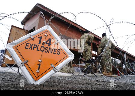 Paratroopers assigned to Dog Company, 3rd Battalion, 509th Parachute Infantry Regiment, 4th Infantry Brigade Combat Team (Airborne), 25th Infantry Division, U.S. Army Alaska, man an ammunition supply point before stress fire training at the sports fire range on Joint Base Elmendorf-Richardson, Alaska, March 24, 2022. The Dog Company Soldiers were evaluated on rapid live-fire target engagement while safely evacuating a simulated battlefield casualty via a SKED improvised litter and breaking contact over hazardous muddy and icy ground. (U.S. Air Force photo/Justin Connaher) Stock Photo