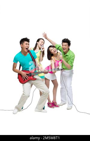 Fashion dynamic young people play the guitar singing Stock Photo