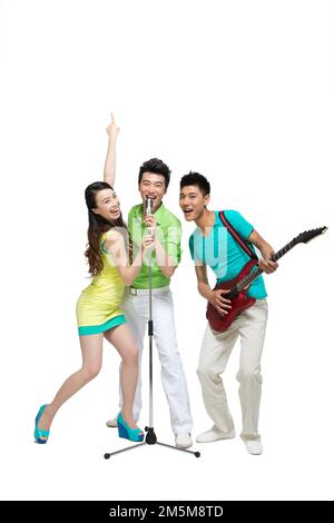 Fashion dynamic young people play the guitar singing Stock Photo