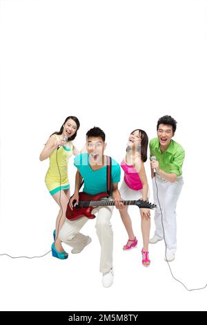 Fashion dynamic young people play the guitar singing Stock Photo