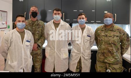 U.S. Air Force Airmen assigned to the 86th Medical Support Squadron pose for a group photo at Ramstein Air Base, Germany, March 24, 2022. After enlisting, U.S. Air Force Senior Airman Dakota Moss was given the job of laboratory technician where he could not only continue his education in health but also educate his colleagues with the wealth of knowledge he already possessed. Stock Photo