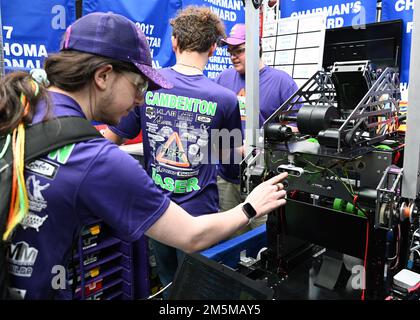 A student competing in the FIRST (For Inspiration and Recognition of Science and Technology) Robotics Regional Competition in Cedar Falls, Iowa, tests the camera on their robot, March 25, 2022. Students used autonomous technology on the robots and trained them to recognize balls and the color of the balls in order to score points. Stock Photo