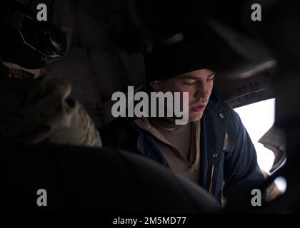 U.S. Air Force Senior Airman Eric Trusdell, a crew chief for the 62nd Maintenance Squadron, replaces a brake on a C-17 Globemaster III during Exercise Rainier War 22A at Joint Base Elmendorf-Richardson, Alaska, March 25, 2022. The exercise is designed to demonstrate the wing’s ability to operate and survive while defeating challenges to the U.S. military advantage in all operating domains – air, land, sea and cyberspace. Stock Photo