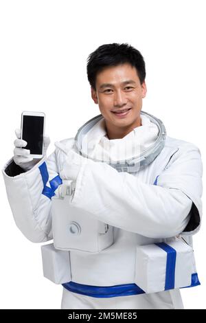 Shed male astronauts display mobile phone Stock Photo