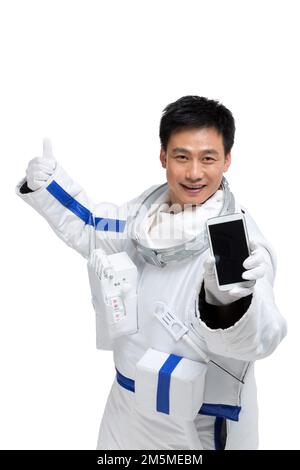 Shed male astronauts display mobile phone Stock Photo