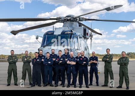 The Royal Navy 'MOHAWK' Flight Crew, 814 Naval Air Squadron, currently operating with the British Royal Navy frigate HMS Portland (F79) commemorates their visit at Marine Corps Air Station (MCAS) Beaufort, S.C., March 25, 2022. The flight crew detoured off their original flight plan of Jacksonville, N.C. to MCAS Beaufort and utilized air station facilities and conducted routine maintenance.    (U.S. Marine Corps photos by Cpl. Aidan Parker) Stock Photo