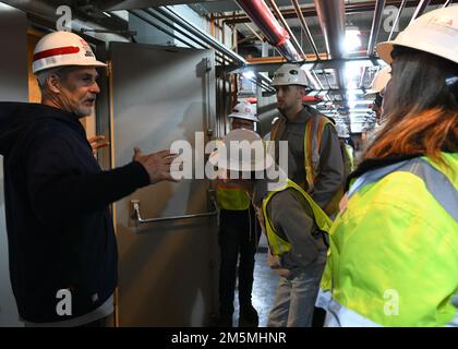 Lipscomb University students peer up at a generator turbine located underground at the Old Hickory Powerplant in Hendersonville, Tennessee as Power Plant Manager Joseph Conatser explains the process of converting water into energy. Stock Photo