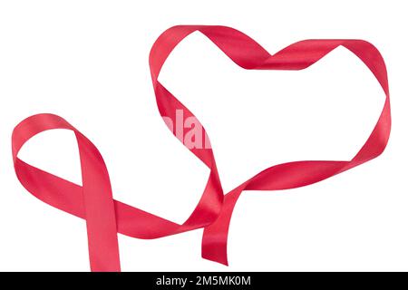 Red heart from a twisted ribbon on a white isolated background. Valentine's Day. Copy space Stock Photo