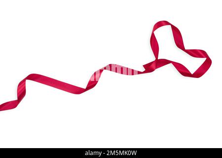 Red heart from curled ribbon on white isolated background. Valentine's Day. Copy space Stock Photo