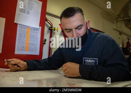 220326-N-TI693-1073    ATLANTIC OCEAN (March 26, 2022) - Engineman 2nd Class Jacob De Leon, from San Antonio, Texas, acts as a damage control plotter during a fire drill aboard the Expeditionary Sea Base USS Hershel "Woody" Williams (ESB 4), March 26, 2022. Hershel "Woody" Williams is on a scheduled deployment in the U.S. Sixth Fleet area of operations in support of U.S. national interests and security in Europe and Africa. Stock Photo