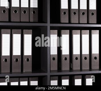 Archive, business documents in folders binders on shelf. Storage in rows. High quality photo Stock Photo
