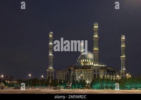 Panoramic view of snow-white modern Hazaret Sultan mosque at night, Nur-Sultan, Astana, Kazakhstan. High quality photo Stock Photo