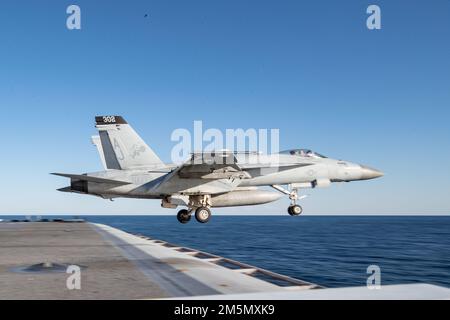 An F/A-18E Super Hornet, attached to the 'Tomcatters' of Strike Fighter Squadron (VFA) 31, launches from USS Gerald R. Ford’s (CVN 78) flight deck, March 28, 2022. Ford is underway in the Atlantic Ocean conducting flight deck certification and air wing carrier qualification as part of the ship’s tailored basic phase prior to operational deployment. Stock Photo