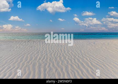 Tranquil beach landscape. Tropical island paradise, shore coast, seaside with cloudy blue sky and soft white sand with ripples. Calm relaxing sea Stock Photo