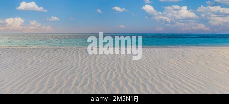 Wide paradise beach panorama background. Relax summer landscape, closeup sand texture, soft blue sky, sunny. Amazing panoramic tropical beach coast Stock Photo