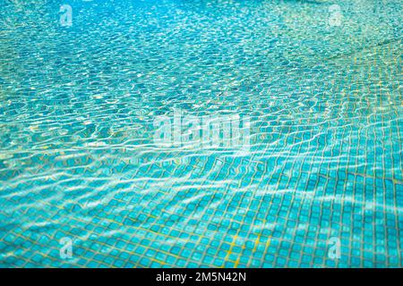 Beautiful relaxing swimming pool water sun reflection background. Ripple water texture background, natural sunlight. Abstract artistic water surface Stock Photo