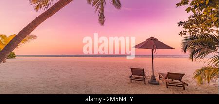 Amazing beach. Romantic chairs umbrella on sandy beach palm leaves, sun sea sky. Summer holiday, couples vacation. Love happy tropical landscape Stock Photo