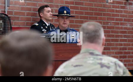 Washington State Patrol District Eight Commander, Capt. James Mjor addresses an audience of U.S. Army Soldiers during a lifesaving award ceremony at Joint Base Lewis McChord, Washington, Mar. 29, 2022.    During the ceremony, five U.S. Army Soldiers were recognized for saving the life of a motorist in Grays Harbor County, Washington in Sept. 2021. Stock Photo