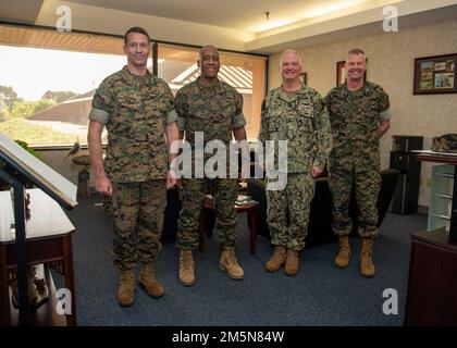 220329-N-KG461-1006    Kings Bay, Ga. (March 29, 2022) From left, Col. Michael Weber, commanding officer of Marine Corps Security Force Battalion; Lt. Gen. Michael E. Langley, commanding general of Marine Forces Command; Capt. Chris Bohner, commanding officer of Naval Submarine Base Kings Bay and Col. Richard Pitchford, commanding officer of Marine Corps Security Force Regiment.  Langley visited Kings Bay to meet with Marines and Sailors assigned to the Marine Corps Security Force Battalion. Stock Photo