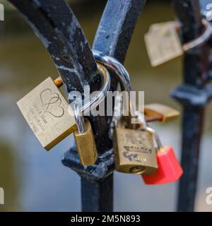 Detail of love locks on a black wrought iron fence at Camden Lock, Camden Town, London. Stock Photo