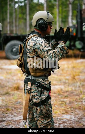 A Marine Corps field artillery cannoneer prepares ammunition during ...