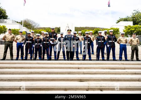 U.S. service members pose for a group photo with U.S. Army Gen. Mark Milley, chairman, Joint Chiefs of Staff, during the National Vietnam War Veterans Day Ceremony at the National Memorial Cemetery of the Pacific, Honolulu, Hawaii, March 29, 2022. The ceremony was held in an effort to honor U.S. service members who served during the Vietnam War. Stock Photo