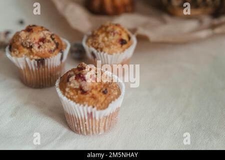 Easter cupcakes with raisins on a white table close-up. The concept of celebrating Happy Easter Stock Photo