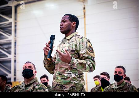 A U.S. Air Force Airman assigned to the 305th Air Mobility Wing speaks during an all call held for Chief Master Sgt. Chad W. Bickley, 18th Air Force command chief, on Feb. 24, 2022, at Joint Base McGuire-Dix-Lakehurst, N.J. Bickley visited the 305 Air Mobility Wing to learn how the unit contributes to the 18th Air Force airlift and aerial refueling missions, and spoke with Airmen to learn about their successes and challenges. As Air Mobility Command’s sole numbered Air Force, 18th AF is tasked with presenting trained, equipped, and ready forces for worldwide operational requirements. Stock Photo