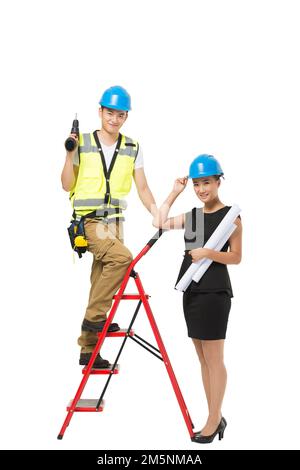 Female building designers and construction personnel Stock Photo
