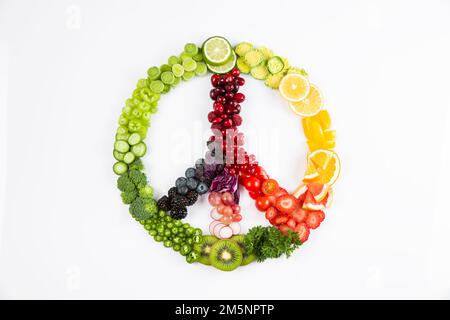 peace sign made of fruits, on a colorful white background Stock Photo