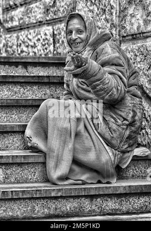 Portrait of a female tramp on the city street. Stock Photo